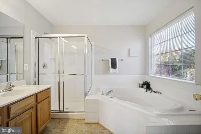 a bathroom with a bathtub and a sink