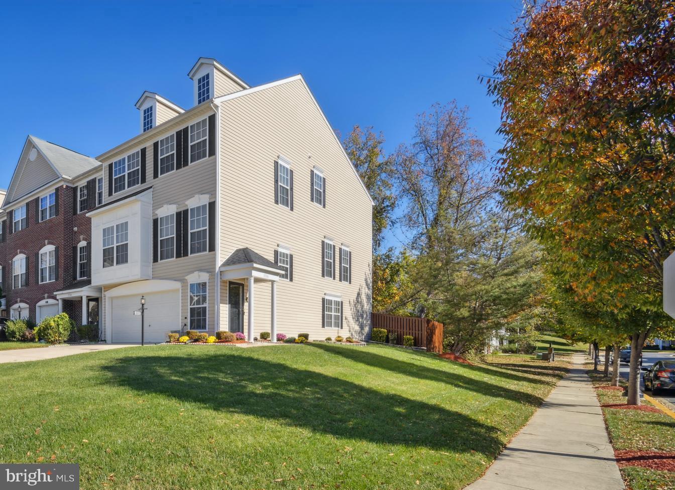 1116 Ring Bill Loop Upper Marlboro, MD 20774 - Photo 3 of 42 a view of a white house with a big yard and large trees