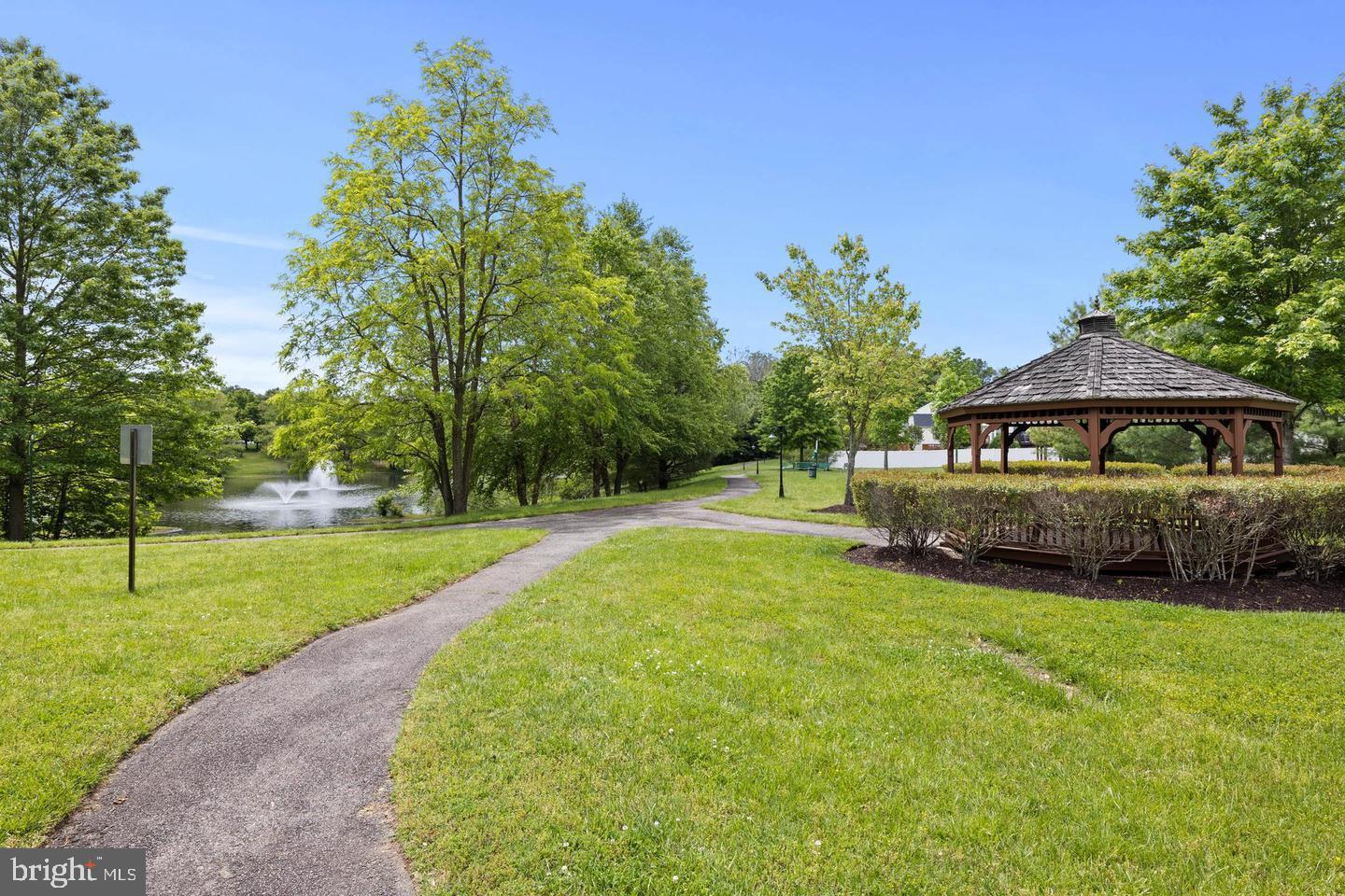 1116 Ring Bill Loop Upper Marlboro, MD 20774 - Photo 37 of 42 a house with green field in front of it