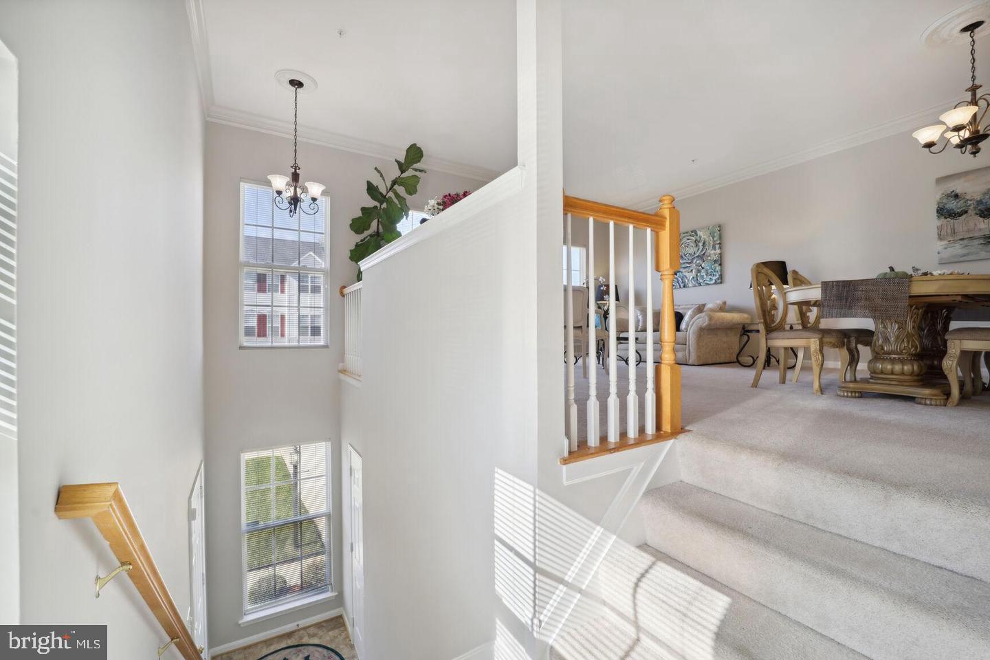 1116 Ring Bill Loop Upper Marlboro, MD 20774 - Photo 6 of 42 a living room with furniture and a chandelier