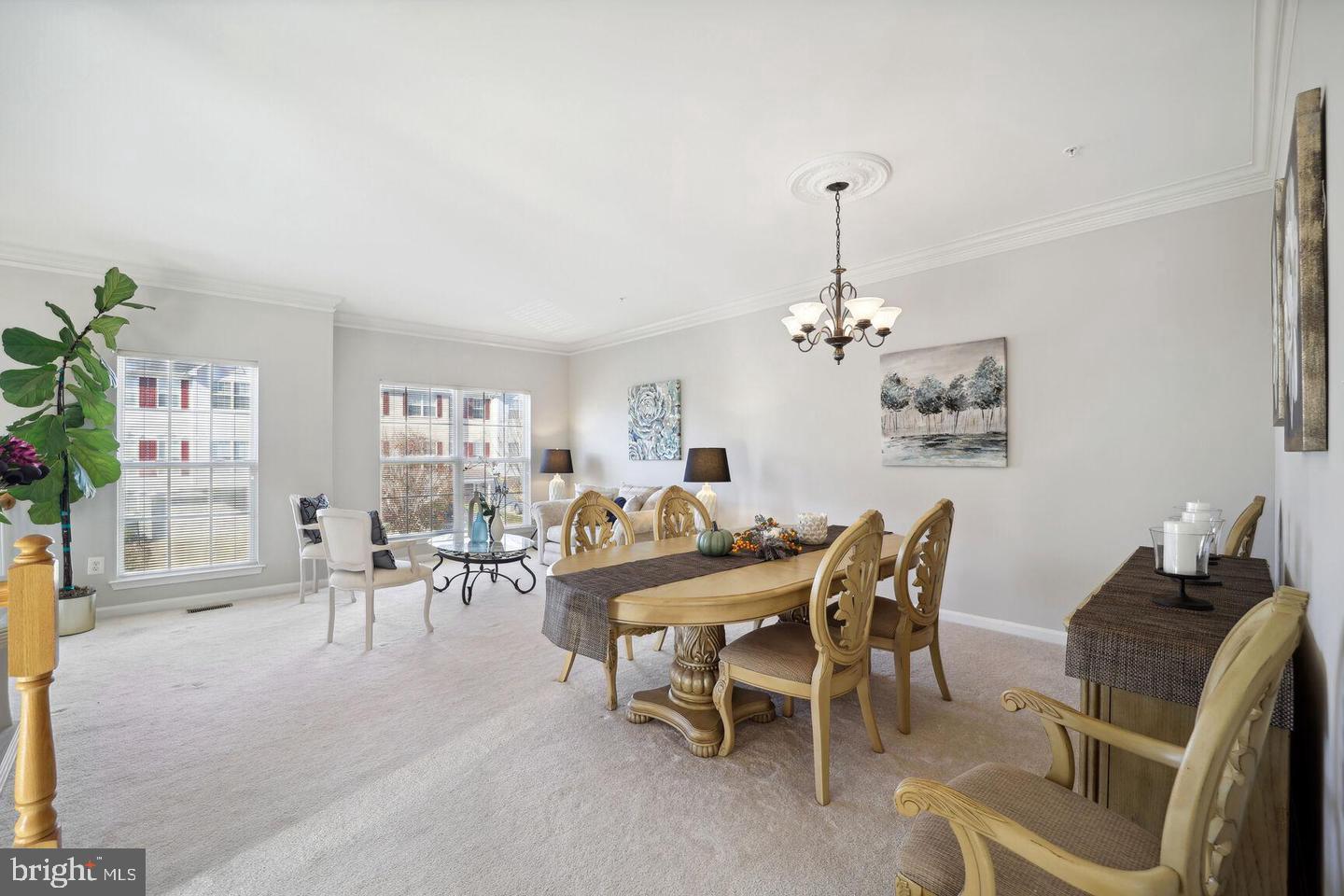 1116 Ring Bill Loop Upper Marlboro, MD 20774 - Photo 10 of 42 a dining room with furniture a chandelier and window