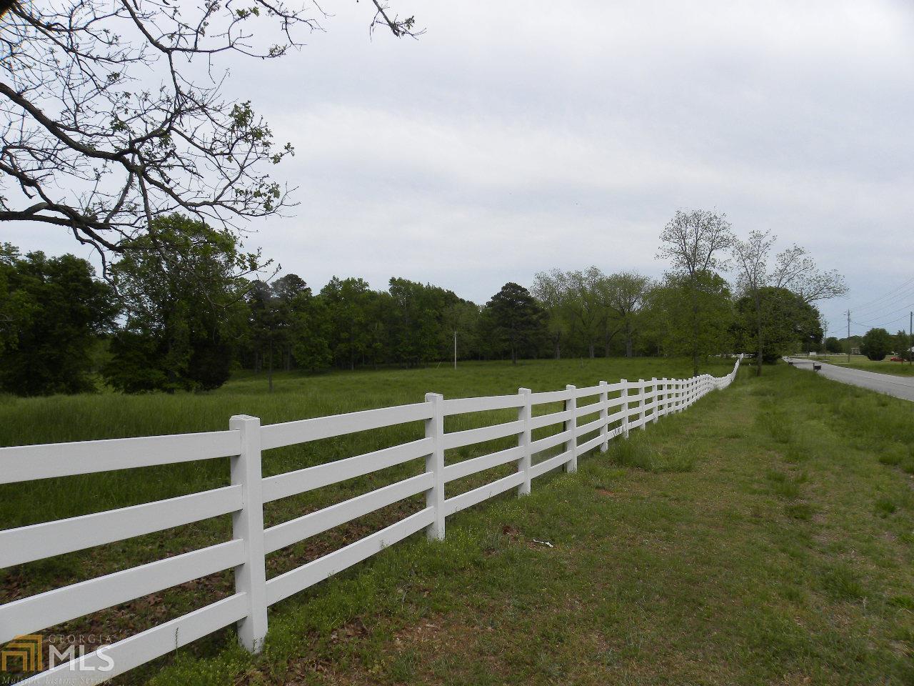 0 Keys Ferry Jackson, GA 30233 - Photo 1 of 1 a view of a bench in a field with wooden fence