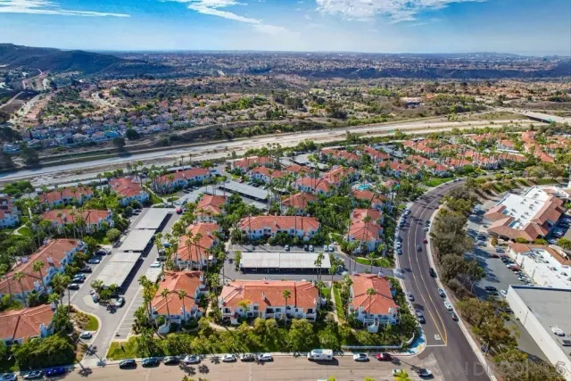 a aerial view of a house with a yard and plants