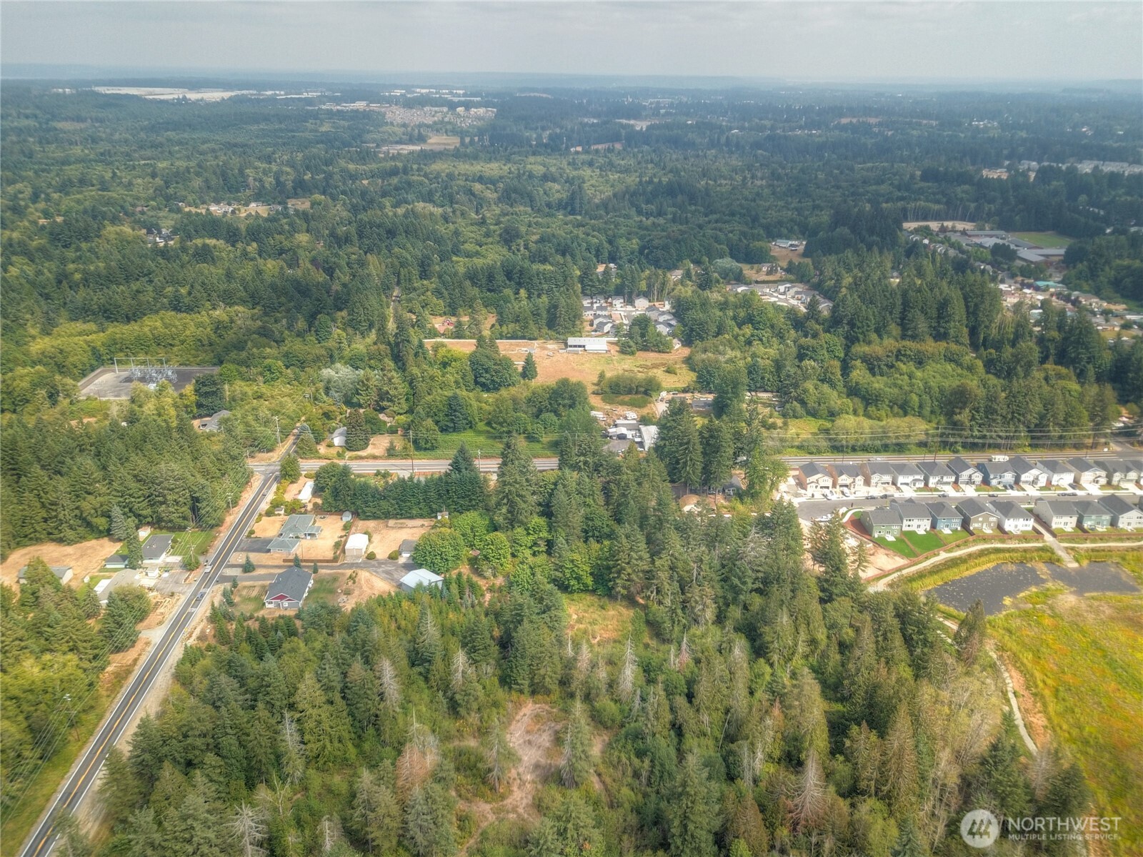 2411 Sleater Kinney Road Northeast Olympia, WA 98506 - Photo 14 of 14 a view of a lake with houses