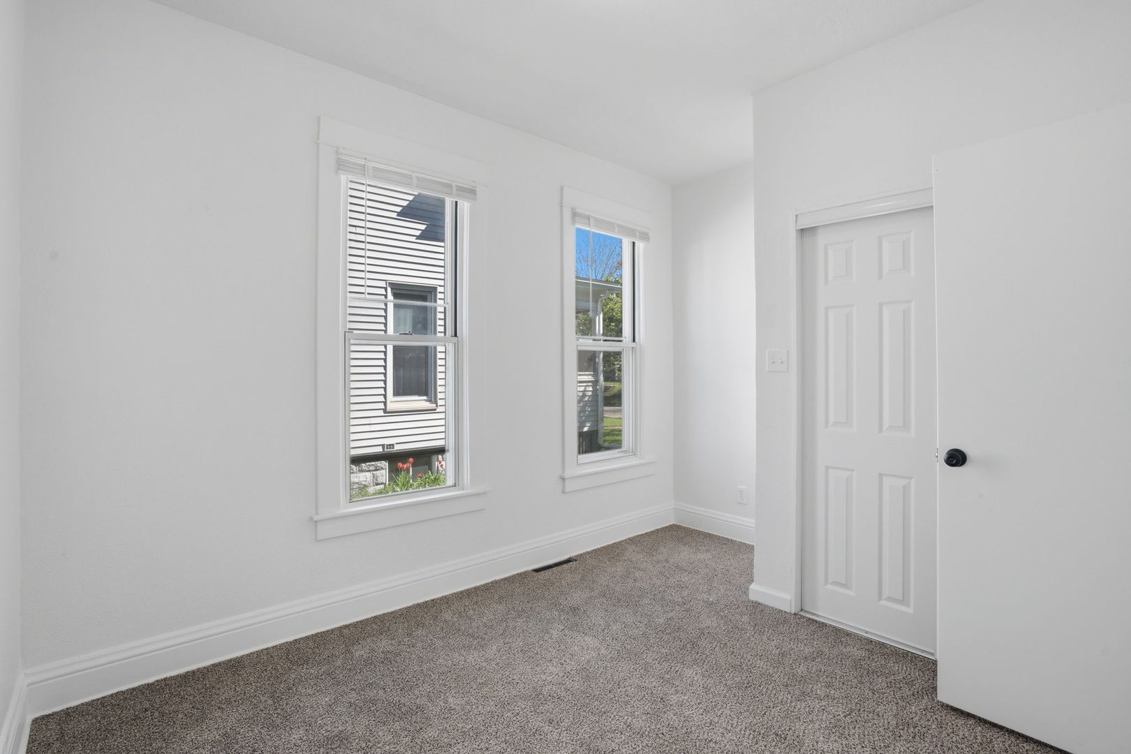 1927 14th Street Moline, IL 61265 - Photo 13 of 25 a view of an empty room with a window