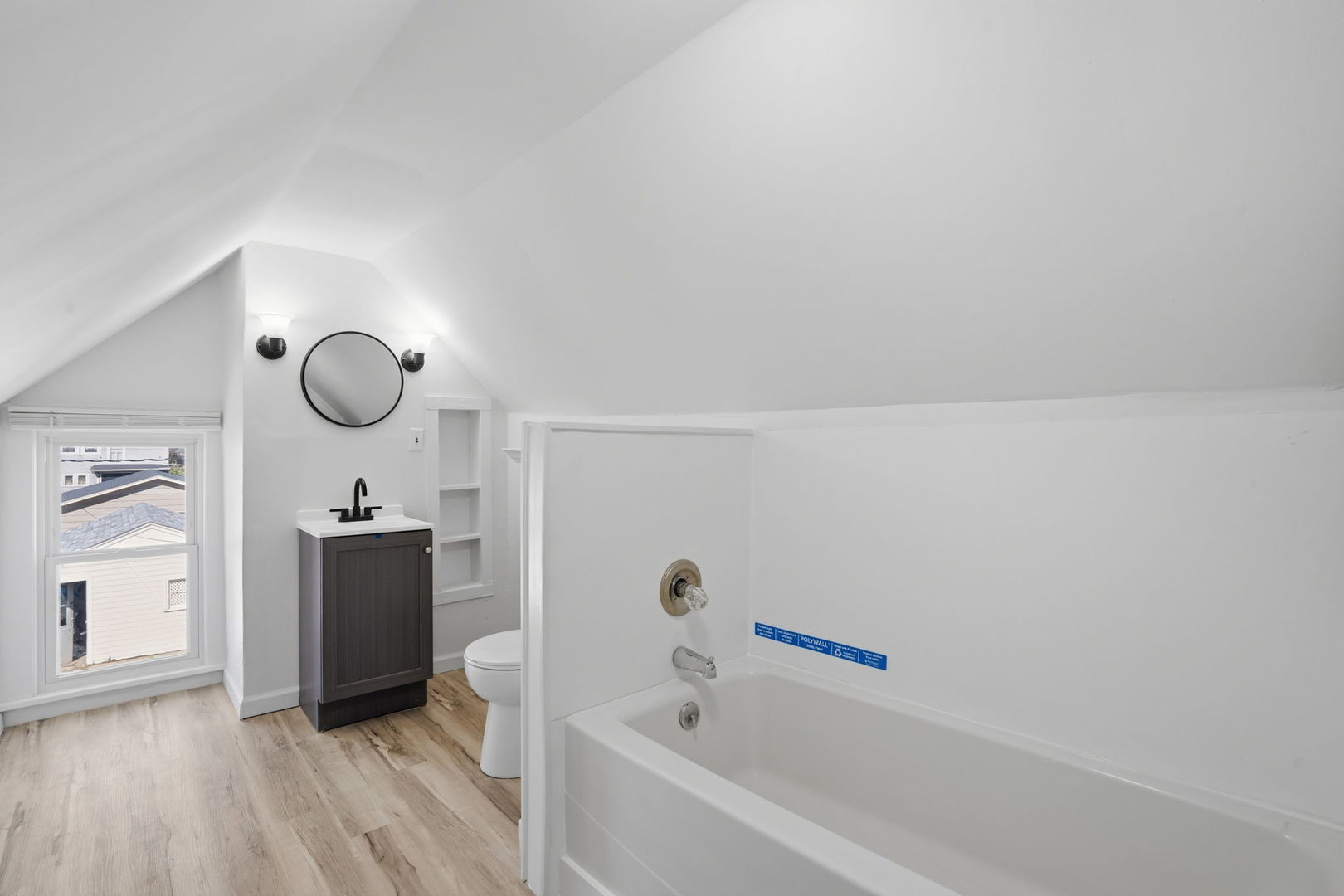 1927 14th Street Moline, IL 61265 - Photo 16 of 25 a bathroom with a tub sink and mirror