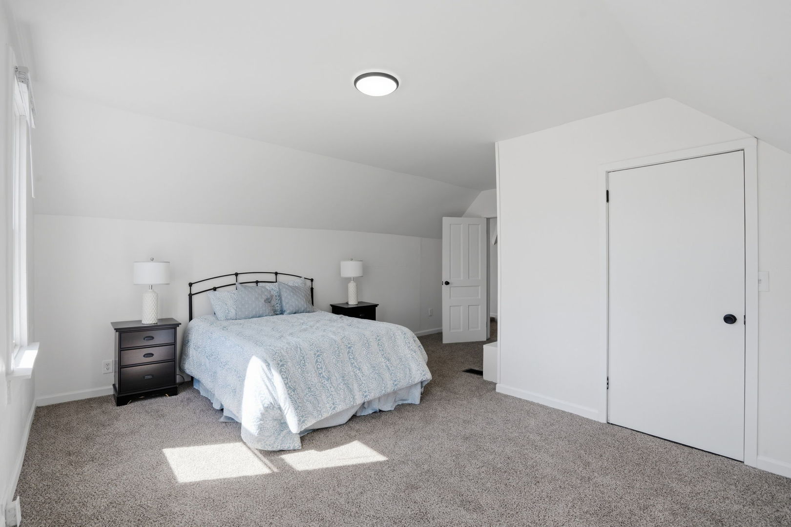 1927 14th Street Moline, IL 61265 - Photo 21 of 25 a bedroom with a bed and a night stand