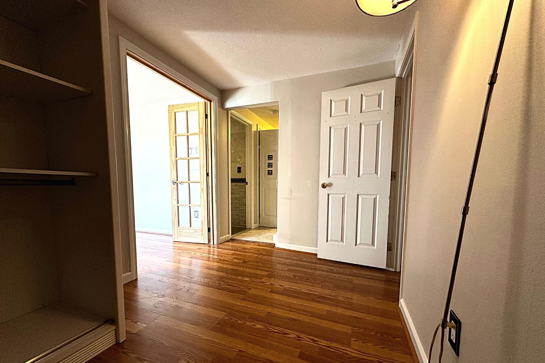 70 North Street, Unit E Hyannis, MA 02601 - Photo 16 of 29 a view of a hallway with wooden floor and staircase
