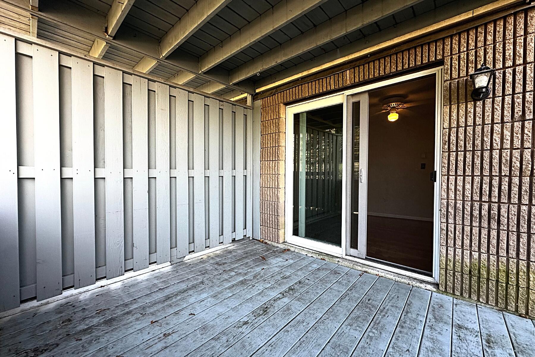 70 North Street, Unit E Hyannis, MA 02601 - Photo 19 of 29 a view of wooden balcony