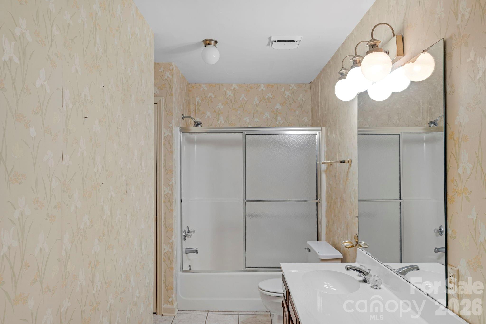 15015 Pawnee Trail Matthews, NC 28104 - Photo 16 of 39 a bathroom with a sink and a mirror