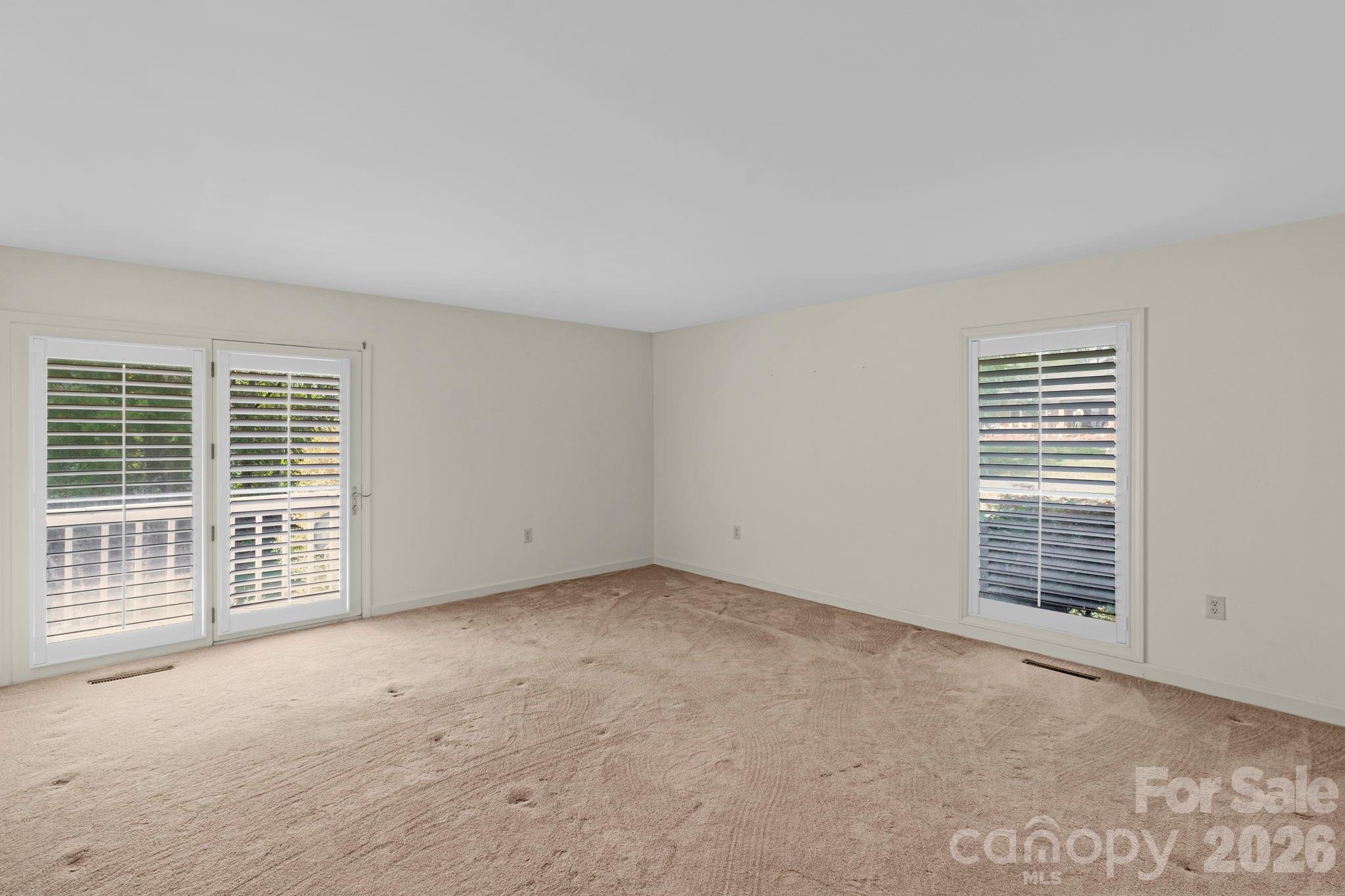 15015 Pawnee Trail Matthews, NC 28104 - Photo 17 of 39 an empty room with windows