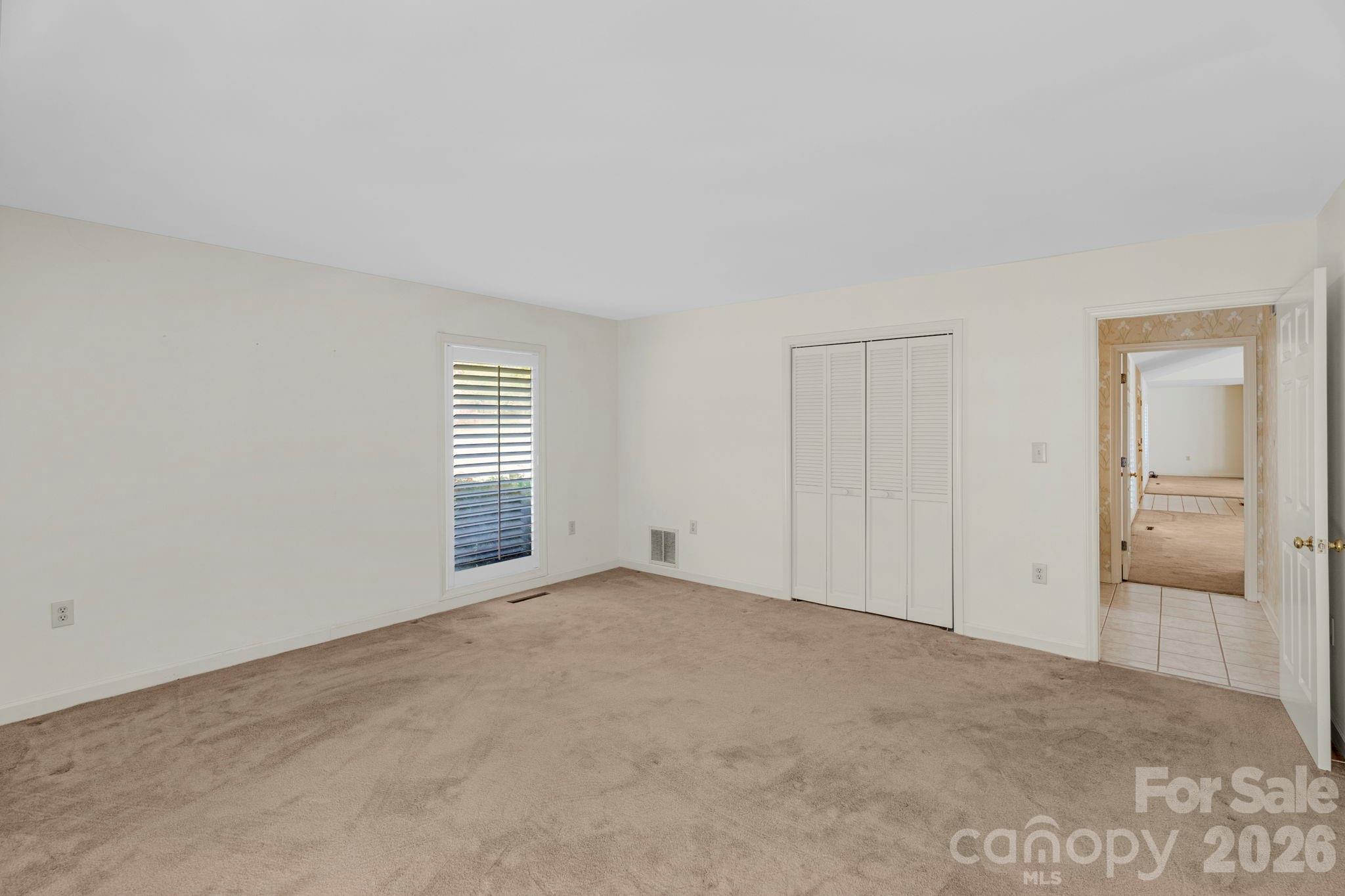 15015 Pawnee Trail Matthews, NC 28104 - Photo 18 of 39 a view of an empty room with a window