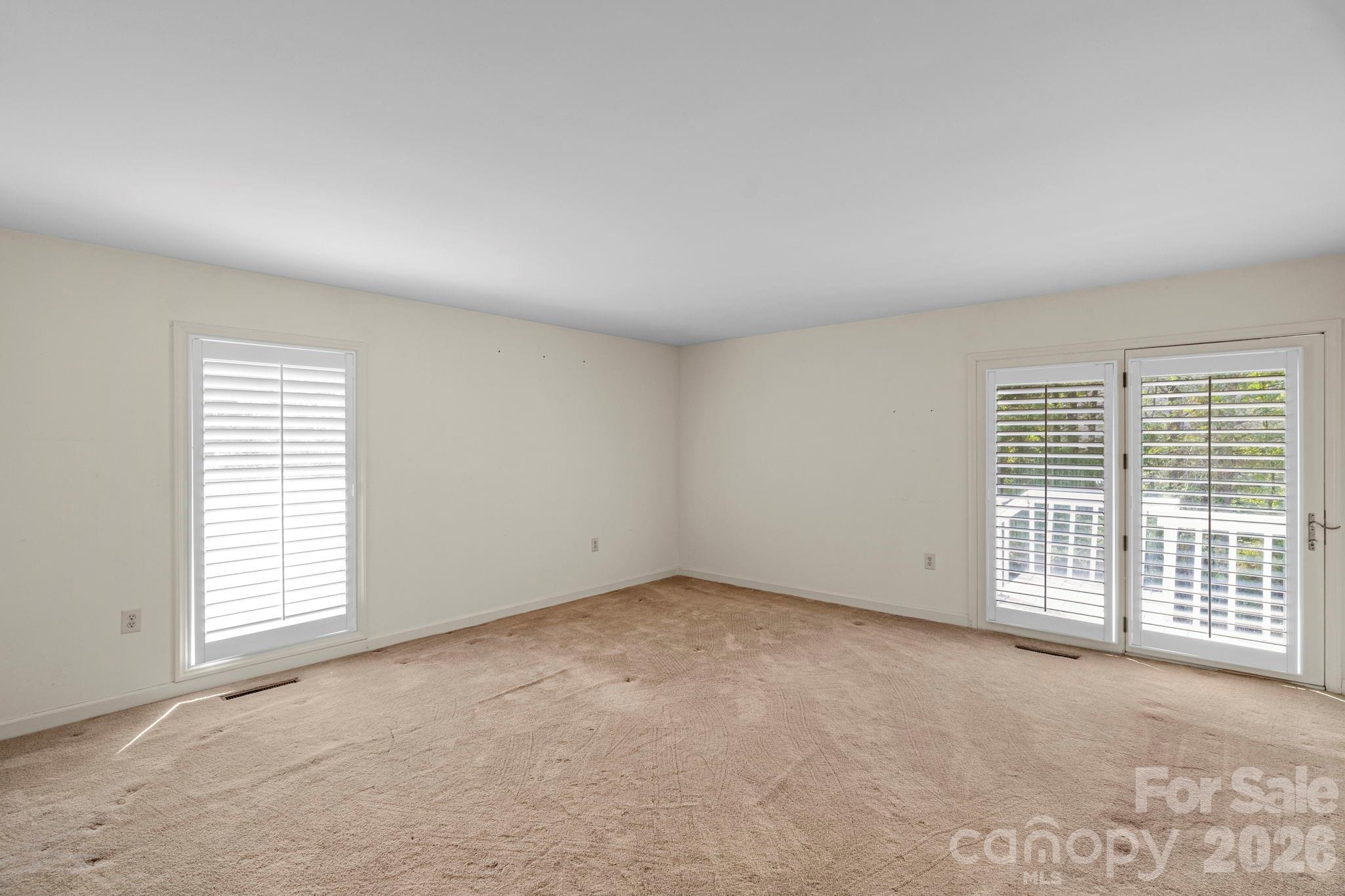 15015 Pawnee Trail Matthews, NC 28104 - Photo 26 of 39 an empty room with windows