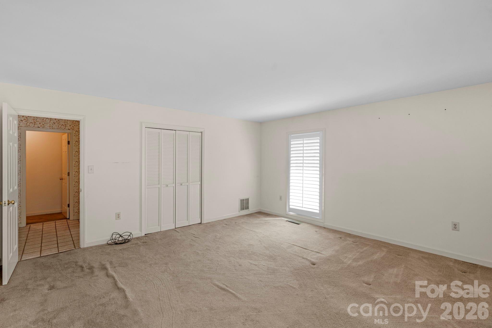 15015 Pawnee Trail Matthews, NC 28104 - Photo 27 of 39 an empty room with windows