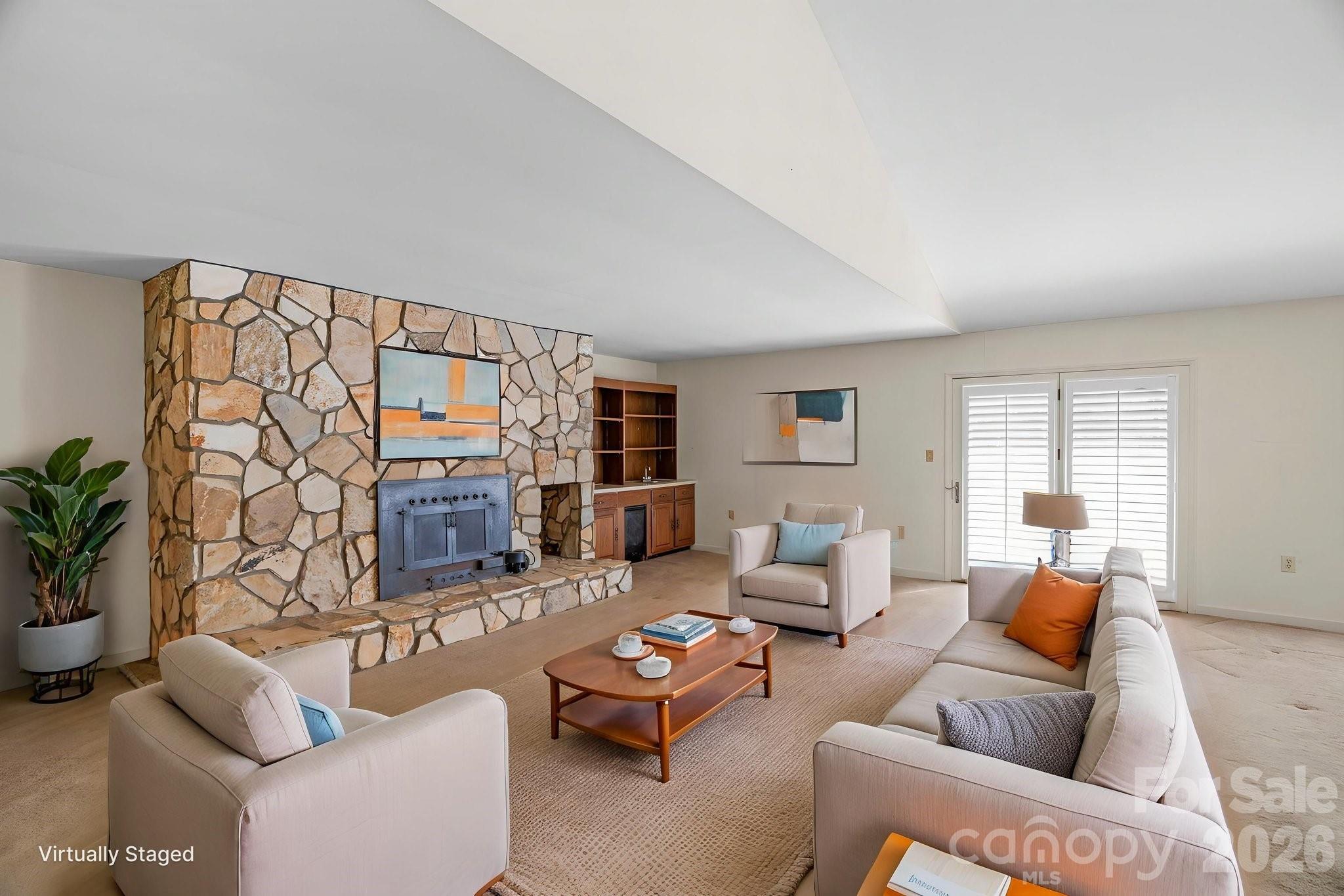 15015 Pawnee Trail Matthews, NC 28104 - Photo 3 of 39 a living room with furniture and a fireplace