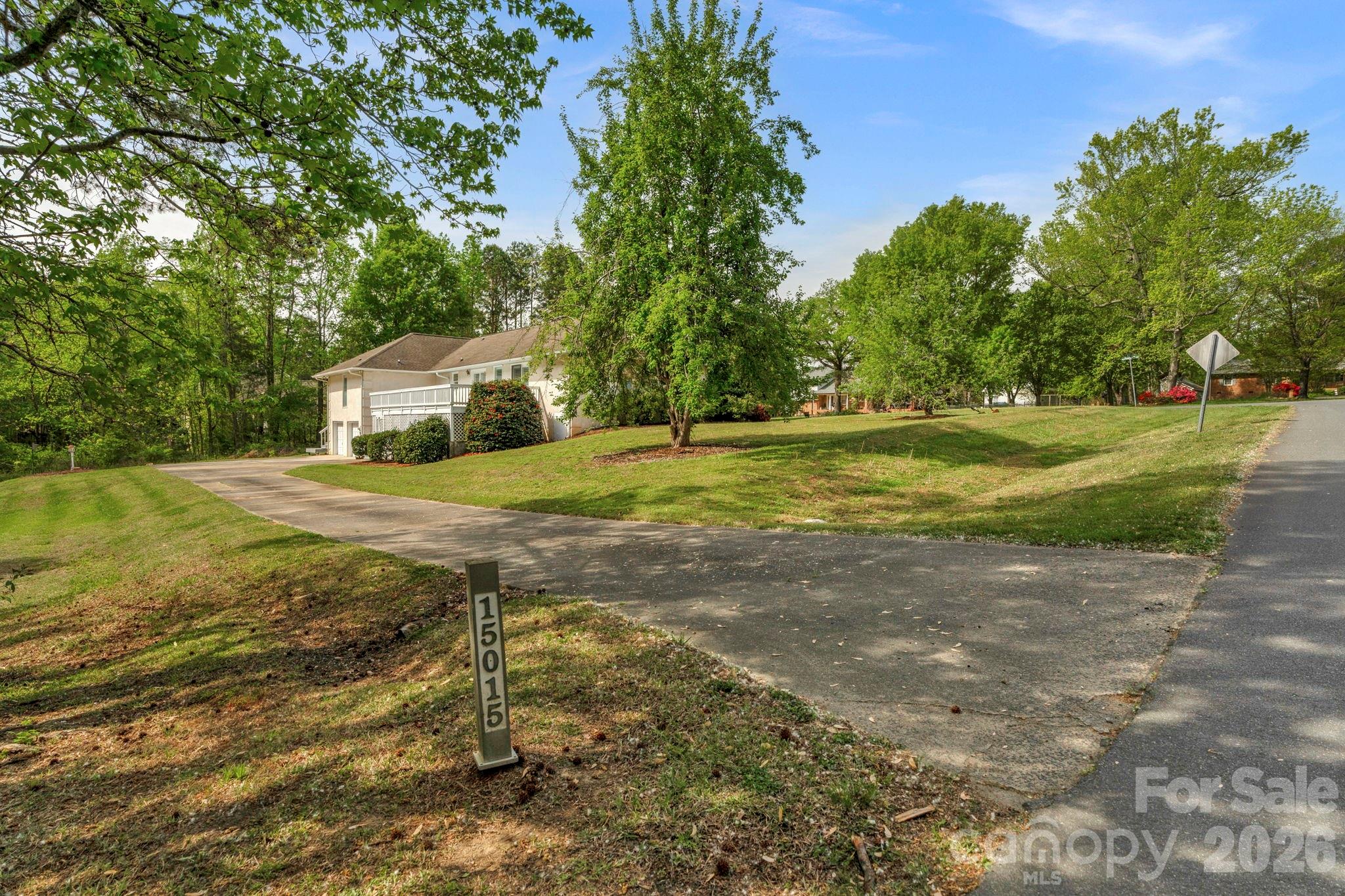 15015 Pawnee Trail Matthews, NC 28104 - Photo 31 of 39 a view of a yard with large trees