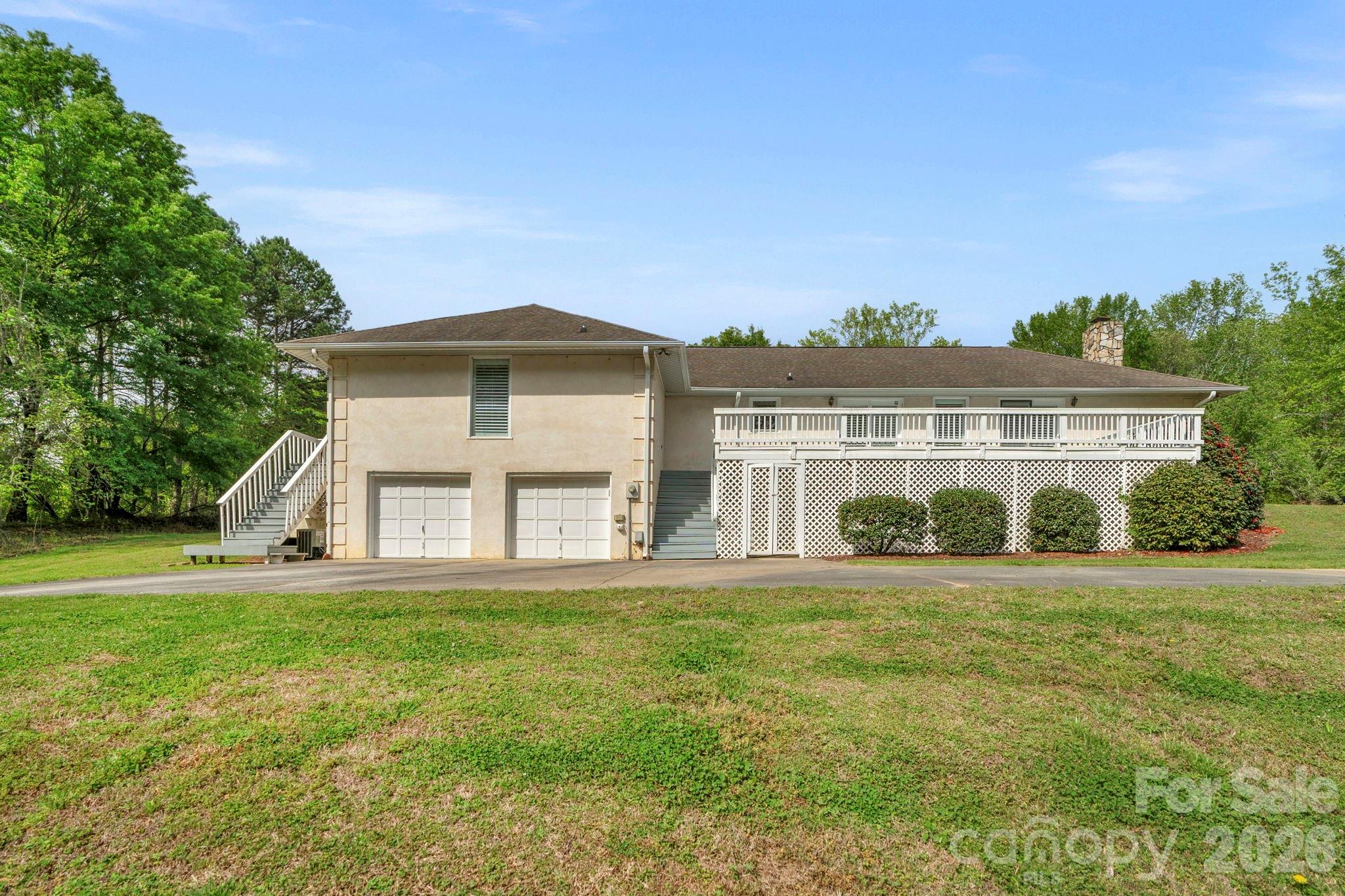 15015 Pawnee Trail Matthews, NC 28104 - Photo 34 of 39 a front view of a house with a yard and trees