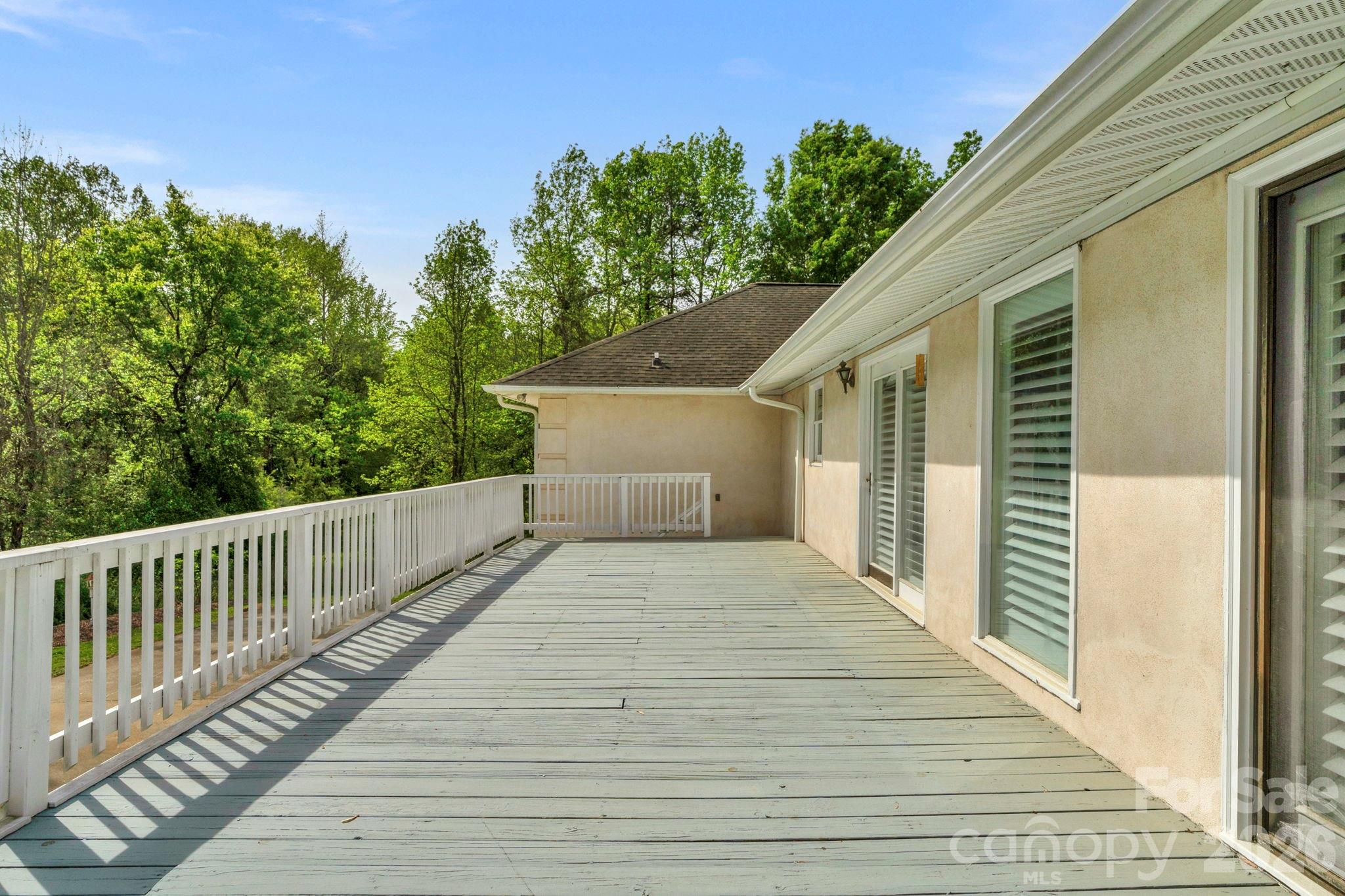15015 Pawnee Trail Matthews, NC 28104 - Photo 37 of 39 a balcony with wooden floor and fence