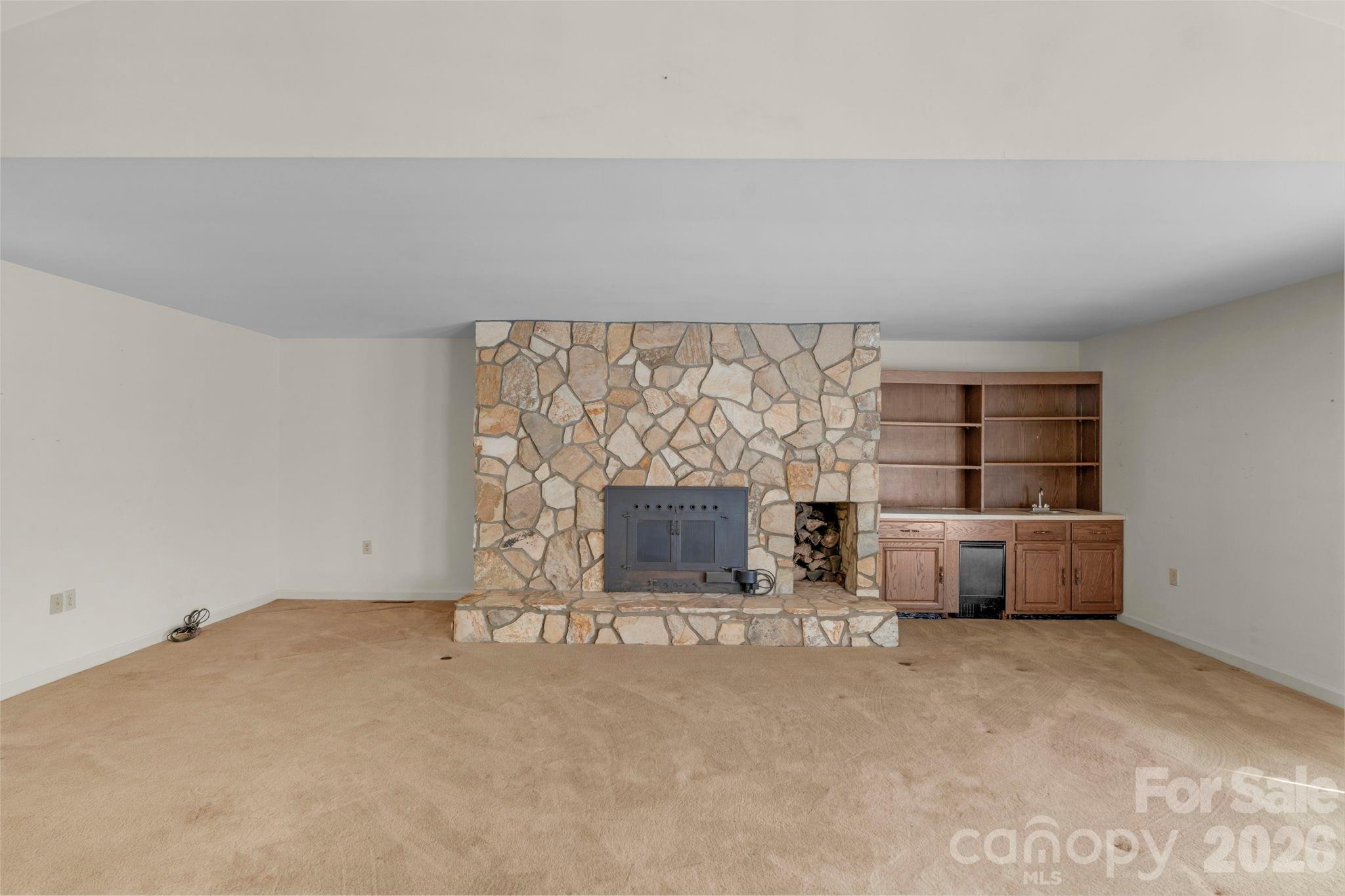 15015 Pawnee Trail Matthews, NC 28104 - Photo 4 of 39 an empty room with fireplace