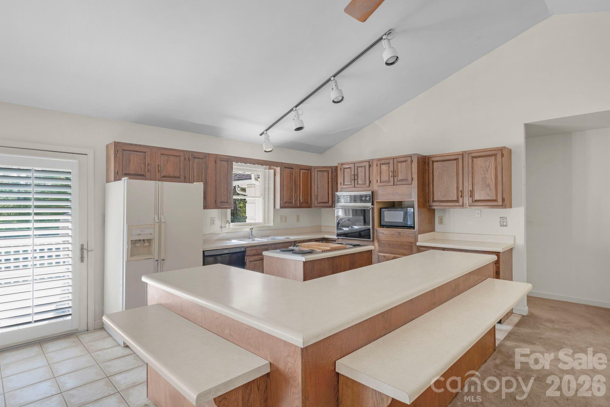15015 Pawnee Trail Matthews, NC 28104 - Photo 5 of 39 a living room with stainless steel appliances granite countertop furniture and a view of kitchen