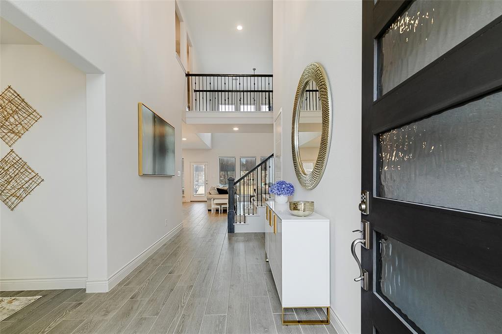 812 Knoxbridge Road Forney, TX 75126 - Photo 1 of 1 a view of living room with wooden floor and furniture