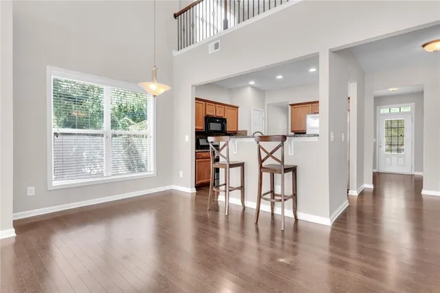 a view of a dining room with furniture window and wooden floor