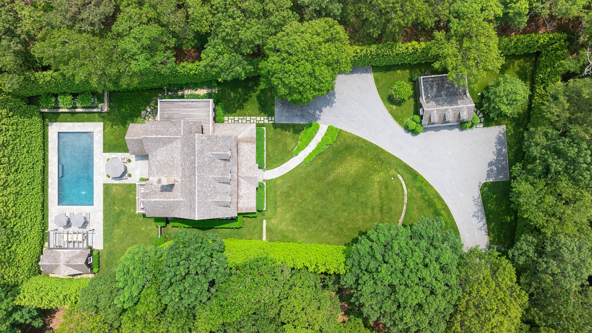 23 Wooded Path Sag Harbor, NY 11963 - Photo 22 of 25 an aerial view of a house with a garden and trees