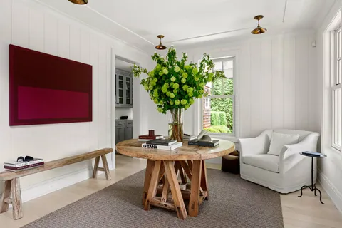 a living room with furniture flowerpot and flower pot