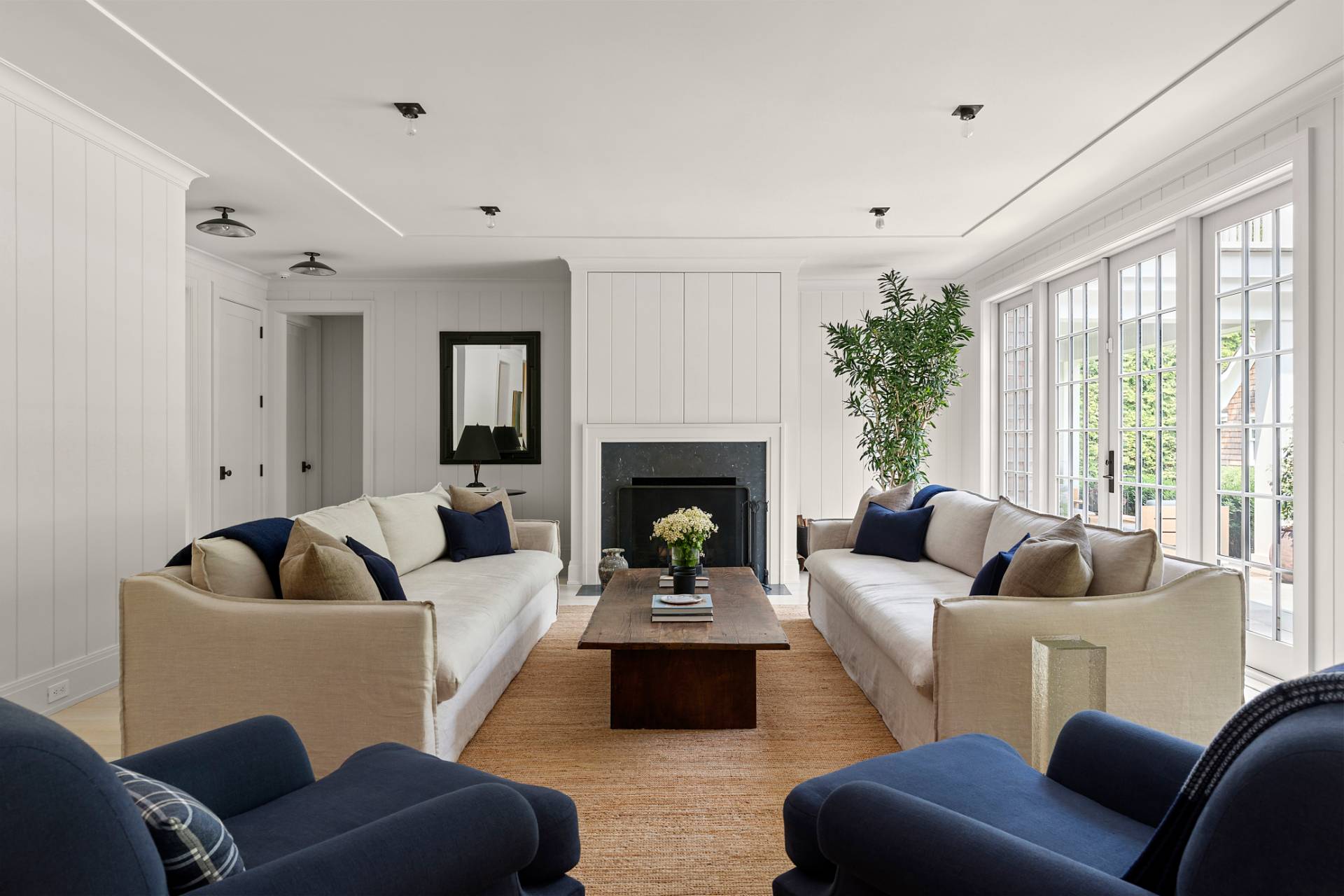 23 Wooded Path Sag Harbor, NY 11963 - Photo 4 of 25 a living room with furniture and a fireplace