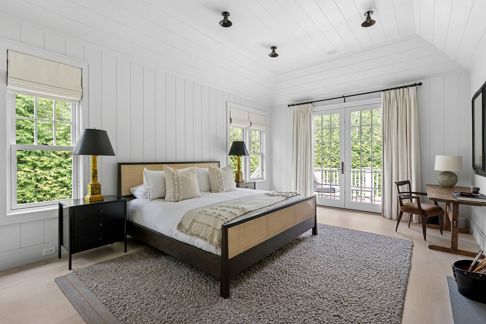 23 Wooded Path Sag Harbor, NY 11963 - Photo 10 of 25 a bedroom with a bed and a large window