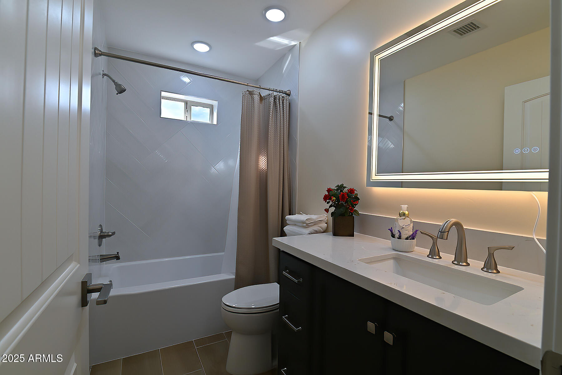 20214 East Mesa Verde Road Mayer, AZ 86333 - Photo 13 of 26 a bathroom with a sink a toilet and shower