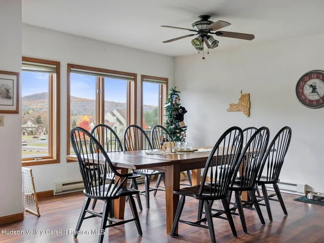 a view of a dining room with furniture window and wooden floor