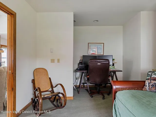 a bedroom with a large bed and a large window