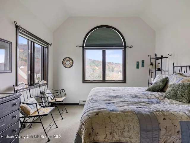 a bathroom with a window and a shower