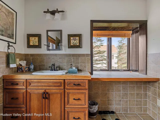 a bedroom with bed and a chandelier