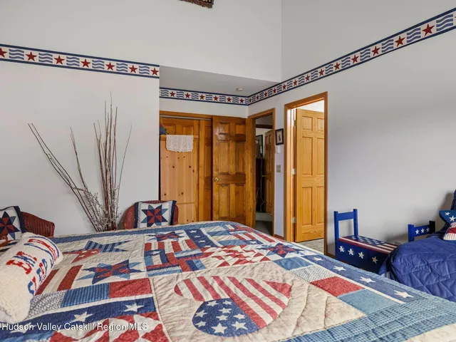 a view of a house with a wooden deck