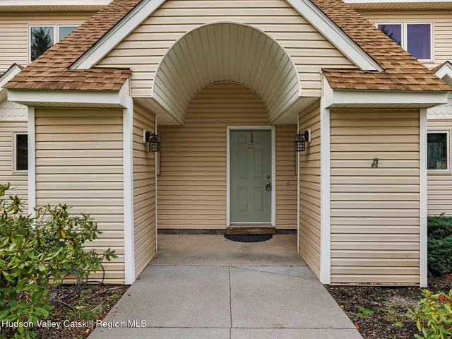 a front view of a house with a garage