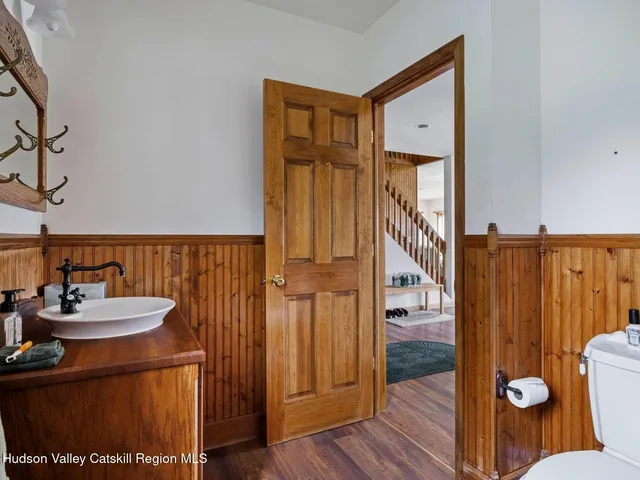 a bathroom with a sink a mirror and a shower