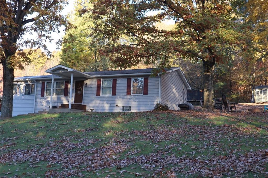 271 Medical Center Road Chicora, PA 16025 - Photo 1 of 18 a front view of a house with a garden