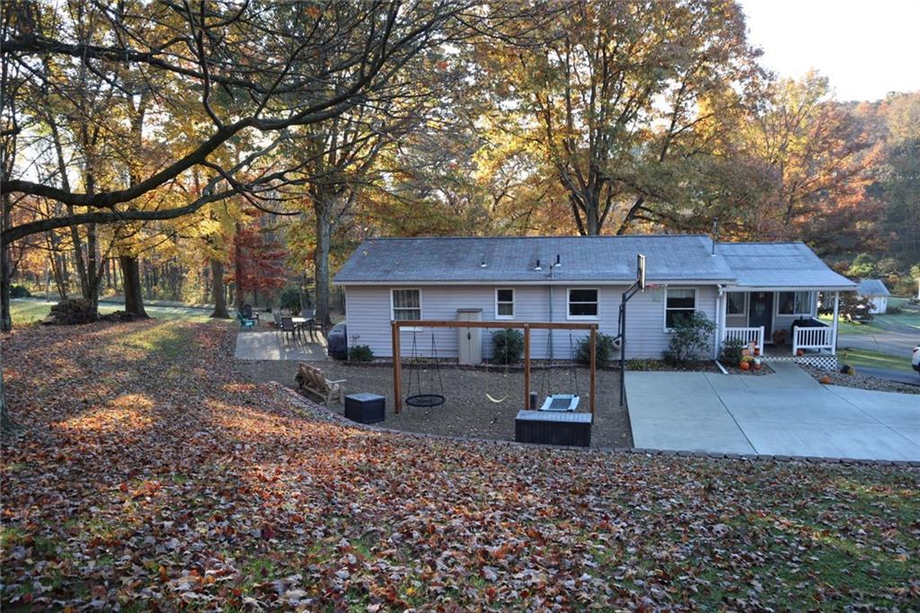 271 Medical Center Road Chicora, PA 16025 - Photo 2 of 18 a front view of a house with garden