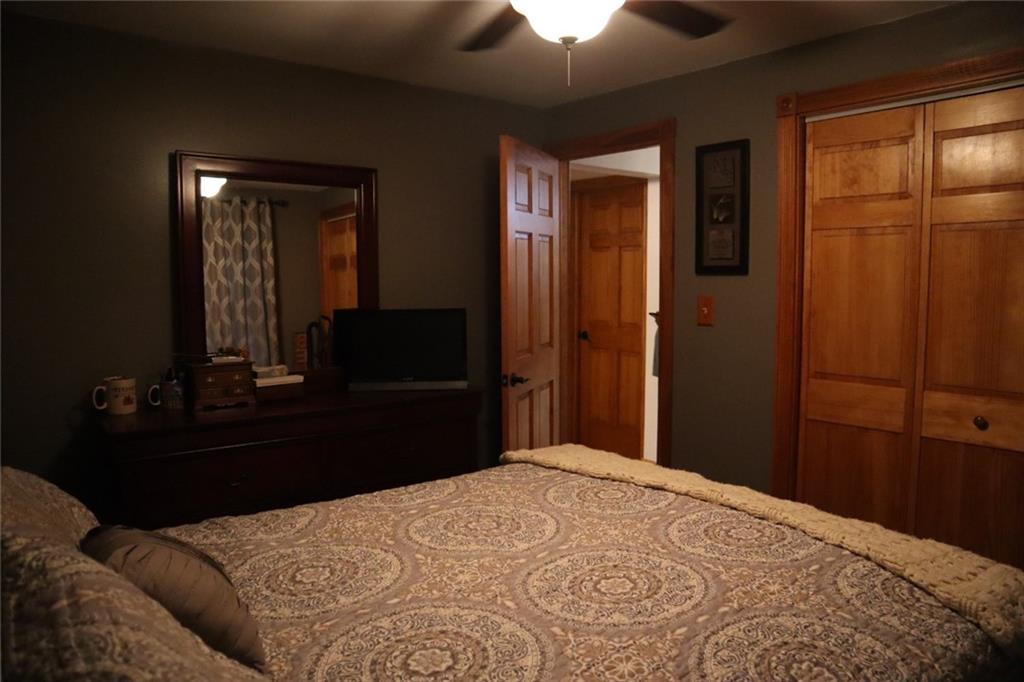 271 Medical Center Road Chicora, PA 16025 - Photo 12 of 18 a bedroom with a bed and a large mirror