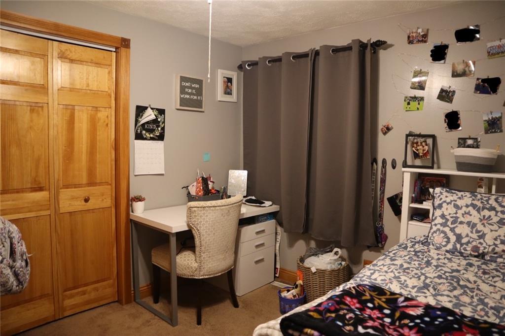 271 Medical Center Road Chicora, PA 16025 - Photo 14 of 18 a room with furniture a rug and a window