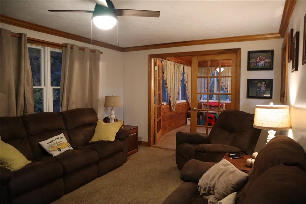 271 Medical Center Road Chicora, PA 16025 - Photo 9 of 18 a living room with furniture and a large window