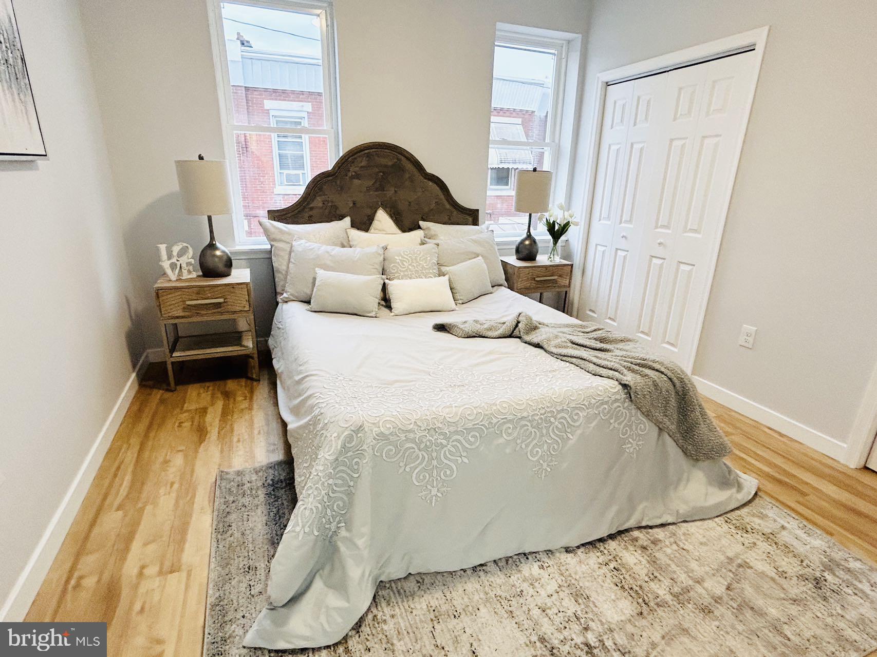 2013 South Bouvier Street Philadelphia, PA 19145 - Photo 8 of 18 a bedroom with a bed and a painting on the wall