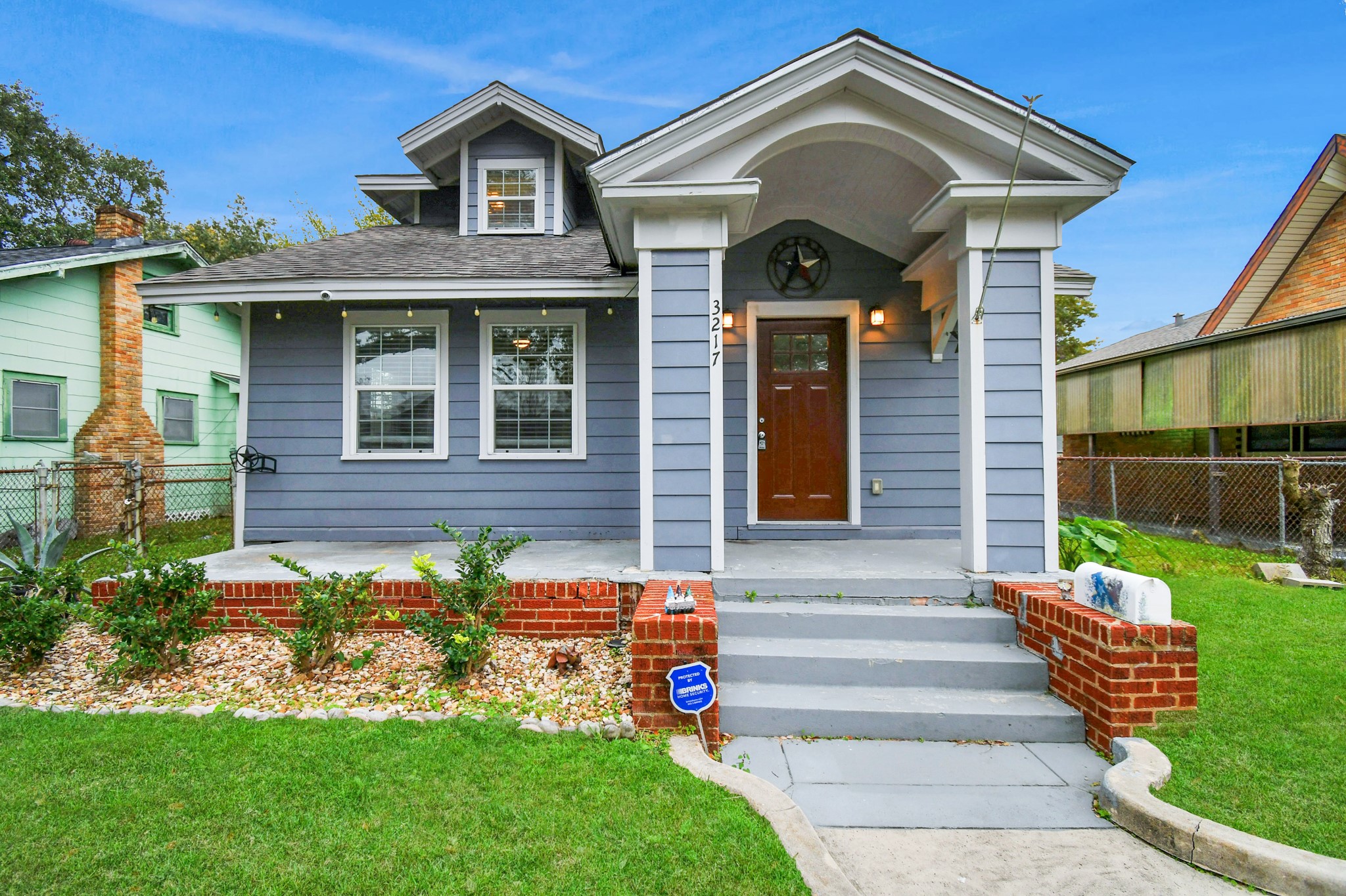 a front view of a house with a yard