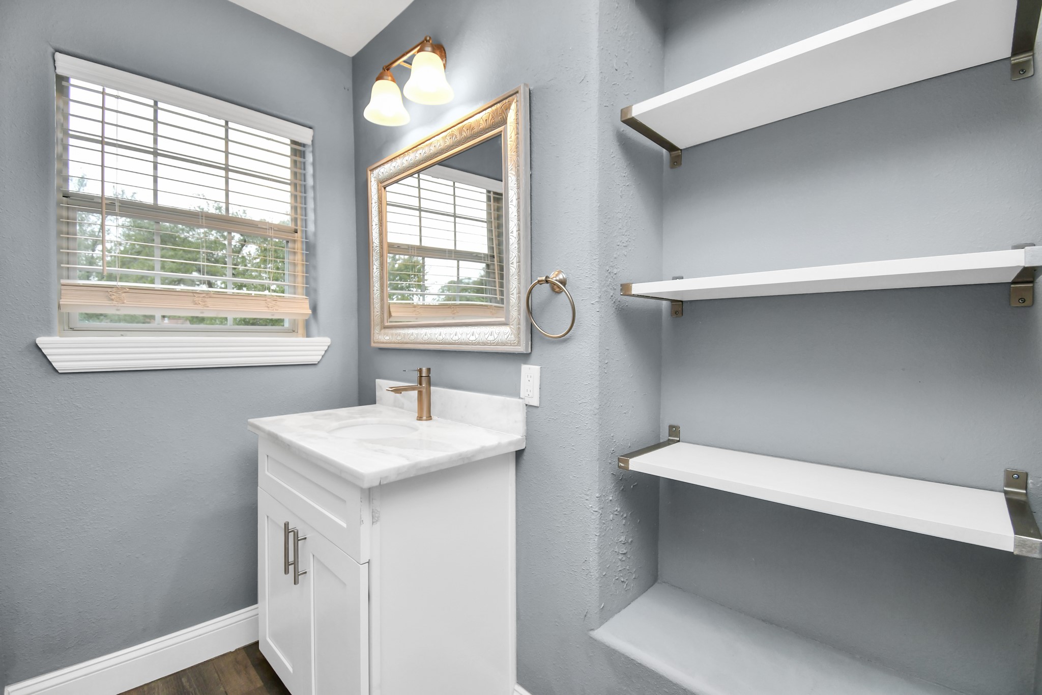 3217 Michigan Street Baytown, TX 77520 - Photo 25 of 37 a bathroom with a sink and a vanity