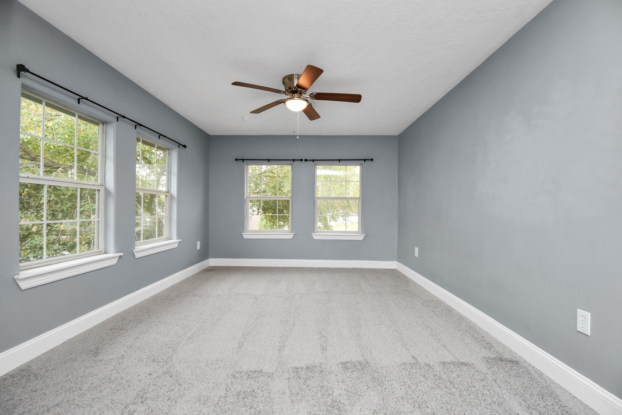 3217 Michigan Street Baytown, TX 77520 - Photo 28 of 37 a view of a livingroom with a ceiling fan and window