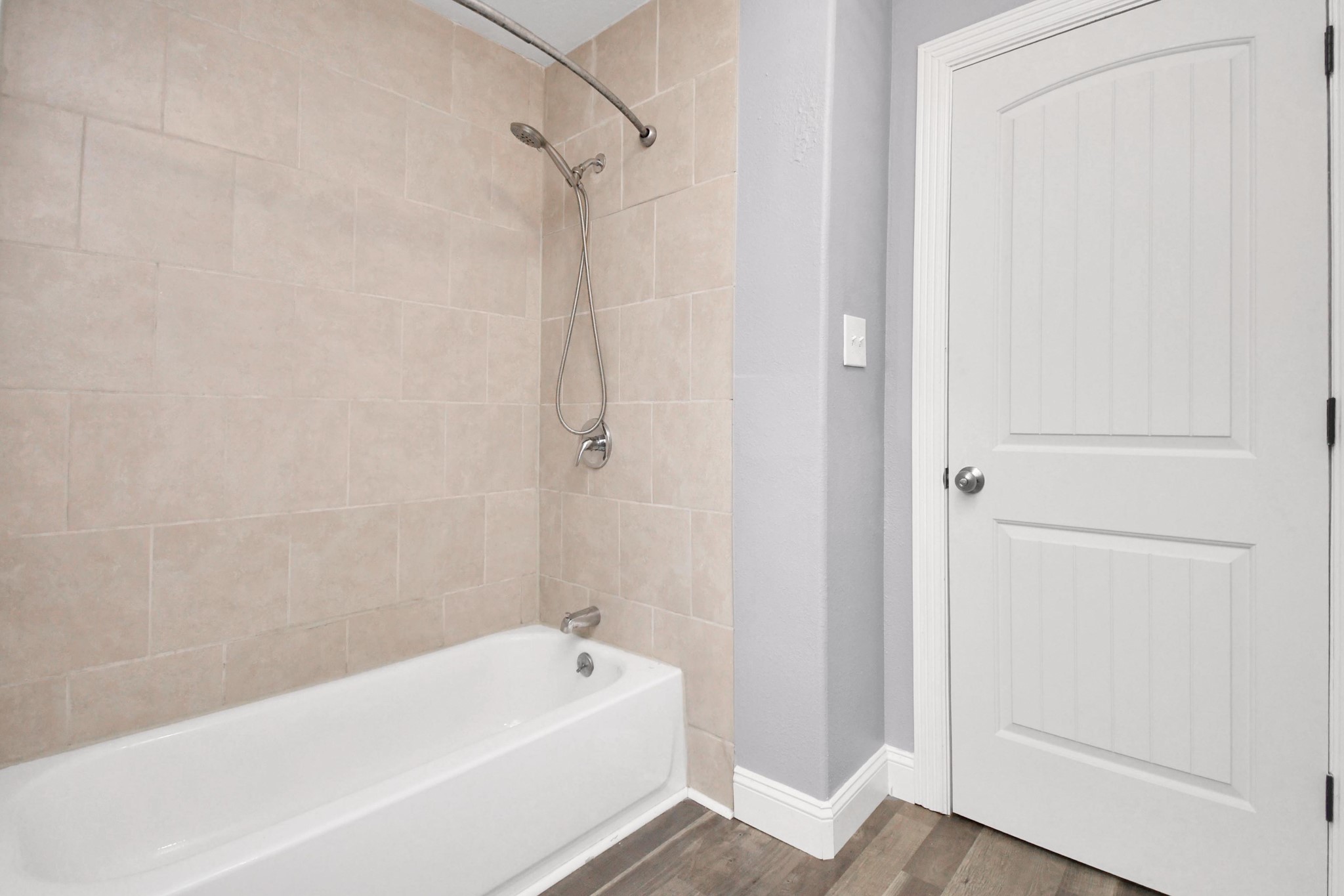 3217 Michigan Street Baytown, TX 77520 - Photo 30 of 37 a bathroom with a bathtub and a shower