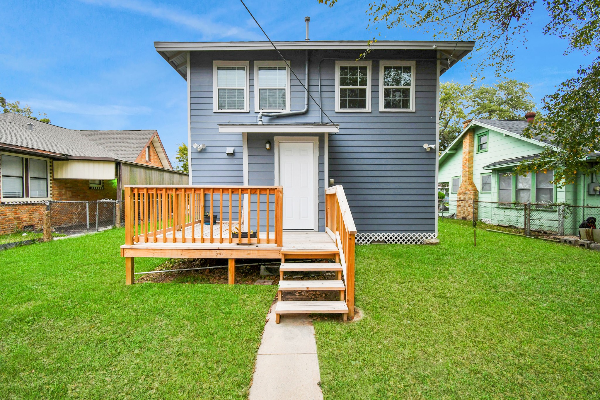 3217 Michigan Street Baytown, TX 77520 - Photo 31 of 37 a front view of a house with a yard table and chairs