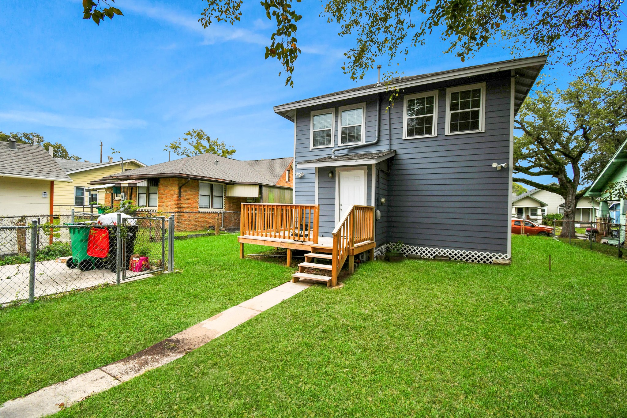 3217 Michigan Street Baytown, TX 77520 - Photo 32 of 37 a view of a house with a backyard and a patio
